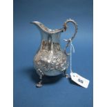 A Hallmarked Silver Jug, Henry Holland, London 1868, of baluster form, detailed in relief with
