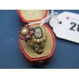 An Early XIX Century 18ct Gold Mourning Ring, with central hair work panel within pearl border,