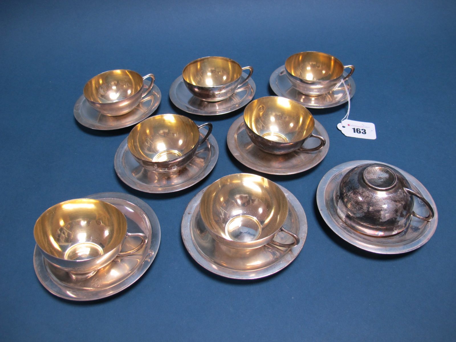 A Set of Eight Spanish Cups and Saucers, the cups gilt lined, initialled, stamped "A. Munoz" "916".