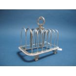A Large Hallmarked Silver Seven Bar Toast Rack, W.E. London 1820, with high central shaped loop