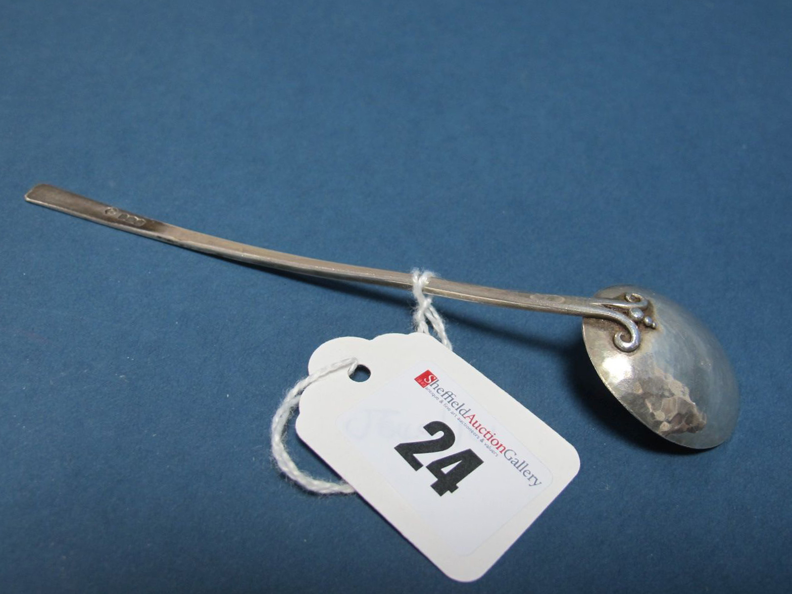 An Arts & Crafts Hallmarked Silver Spoon, Joseph & Joyce Himsworth, Sheffield 1930, with hammered