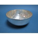 A Modern Bowl, of circular form with hammered finish, on rim base, stamped "Sterling", 18cms