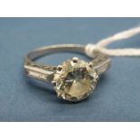 A Large Single Stone Diamond Ring, the (8mm) old brilliant cut stone claw set between diamond set