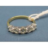 An 18ct Gold Five Stone Diamond Ring, of uniform design, claw set with brilliant cut stones.