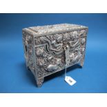 A Chinese Casket, of rectangular form, allover detailed in relief the hinged lid with latch style