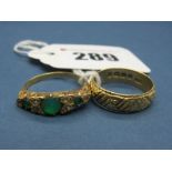 An Emerald Set Ring, of graduated design within scroll carved setting; Together with An 18ct Gold