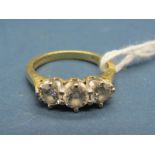 An 18ct Gold Three Stone Diamond Ring, claw set with brilliant cut stones, stamped "1.00 Dia".