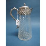 A Plated Mounted Claret Jug, with tapering cylindrical cut glass body, the applied mount detailed