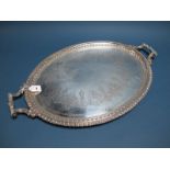 A Large Plated Oval Twin Handled Tray, detailed in relief with decorative border, between angular
