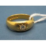 A 22ct Gold Ring, star set to the front with a single stone.