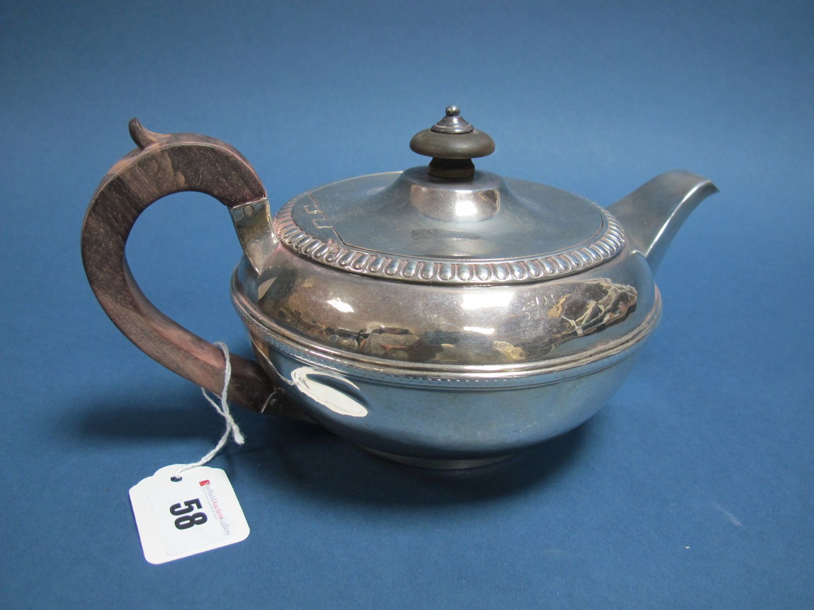 A Hallmarked Silver Teapot, Robert Garrard, London 1808, of compressed circular form with textured