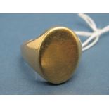 A Gent's Signet Ring, with plain oval panel, indistinctly stamped.