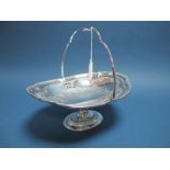 A Decorative Plated Pedestal Dish, of oval form with beaded edge and swing handle, raised on oval