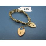 A 9ct Gold Gate Link Style Bracelet, to heart shape padlock clasp, suspending another heart shape