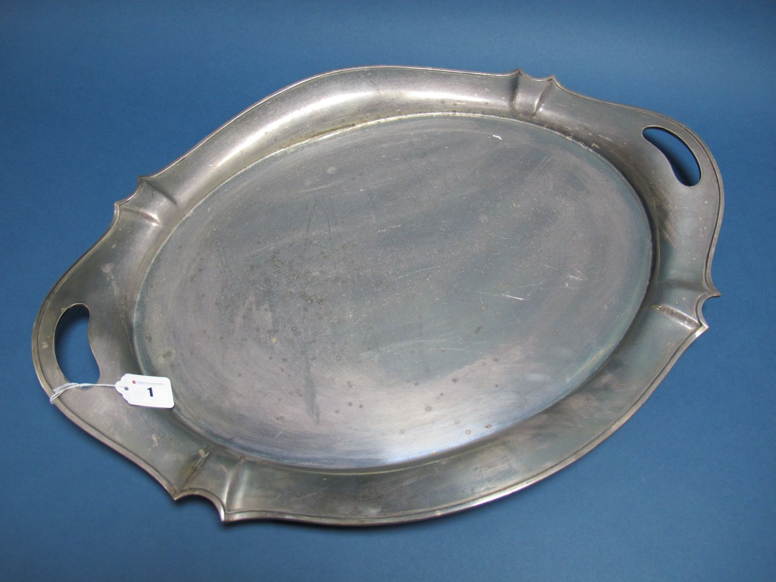 A Thomas Bradbury & Sons Large Plated Twin Handled Tray, of shaped oval design, overall width 64.