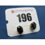 A Pair of Sapphire Single Stone Earstuds, each oval stone claw set.