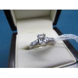 A Platinum Millennium Cut Single Stone Diamond Ring, corner claw set, between diamond set