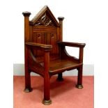 A XIX Century Oak Gothic Chair, with trefoil carved broken pediment to panelled back, shaped arms