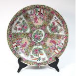 A Modern Canton Famille Rose Charger, painted in multi-coloured enamels with panels of figures,