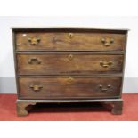 A George III Mahogany Chest of Drawers, the rectangular top with moulded edge, over three long