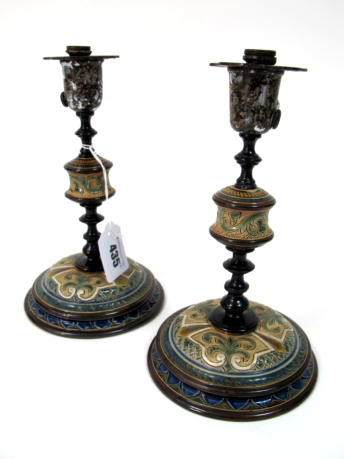 A Pair of Doulton Lambeth Stoneware Candlesticks, designed by Frank Butler, signed in monogram, with