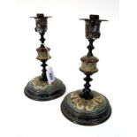 A Pair of Doulton Lambeth Stoneware Candlesticks, designed by Frank Butler, signed in monogram, with