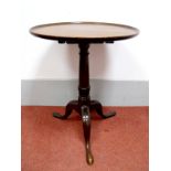 An XVIII Century and Later Mahogany Pedestal Table, with circular dished top, turned pedestal, on