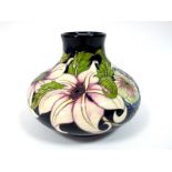 A Modern Moorcroft Pottery Vase, of squat baluster form, painted in the Pure Innocence pattern