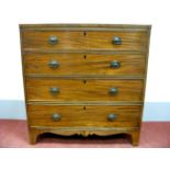 An Early XIX Century Mahogany Chest of Drawers, with crossbanded top, four long drawers, on