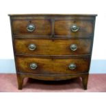 A XIX Century Mahogany Bow Front Chest of Drawers, with crossbanded top over two short and two