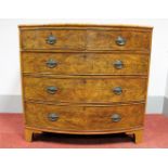 An Early XIX Century Mahogany Bow Fronted Chest of Drawers, fitted with two short and three long
