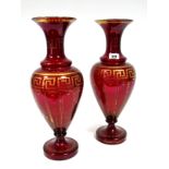 A Pair of XIX Century Ruby Glass Vases, of baluster faceted form, decorated within dot and key