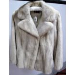 An 'Emba' Natural Blue-Grey Mink Jacket, with rever collar and back half belt, 70cm long,