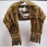 A Light Beige Mink Evening Stole, with five tail tassles to each end.