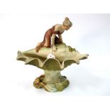 A Royal Dux Art Nouveau Porcelain Centrepiece Bowl, modelled as a maiden looking into a conch shell,