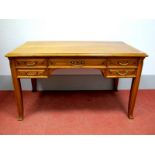 An Early XX Century Continental Walnut Desk, the rectangular top with moulded edge, central drawer