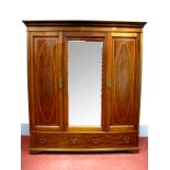 An Edwardian Inlaid Mahogany Triple Wardrobe, with stepped cornice, central rectangular shaped