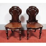 A Pair of XIX Century Mahogany Hall Chairs, the backs with 'C' scroll decoration, serpentine