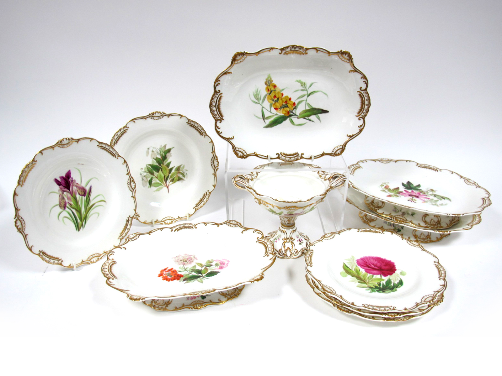 A Mid XIX Century English Porcelain Part Dessert Service, each piece differently painted with a