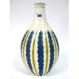 An Early 1950's Poole Pottery White Earthenware Carafe Vase, the blue and yellow stylised leaf