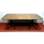 A XIX Century Style Mahogany Dining Table, with 'D' shaped ends to central leaf, on twin turned