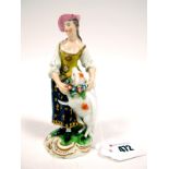 An XVIII Century Derby Porcelain Figure of a Shepherdess, standing, wearing a white blouse with