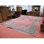 An Early XX Century Wool Carpet, with central floral elongated motif in the Indian manner,