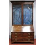 An XVIII Century Mahogany Bureau Bookcase, with stepped pediment, astragal glazed doors (two panes