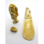 A Late XIX Century Japanese Ivory Shoe Horn, carved with two figures, 17.5cm high; A Japanese