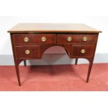 An Early XIX Century Mahogany Sideboard, the crossbanded top with boxwood stringing, two small
