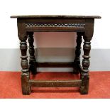A XVII Century and Later Joined Oak Stool, with rectangular top, carved frieze, on turned and