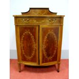 An Edwardian Inlaid Bow Fronted Music Cabinet, with shaped low back, quartered and crossbanded