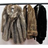 A Three--quarter Length Fur Coat, possibly fox/wolf, with shawl collar, 82cm long; a Walsh's of