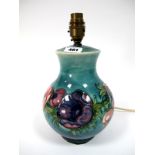 A Moorcroft Pottery Table Lamp, of ovoid form, painted in the Anemone pattern against a shaded